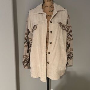 Corduroy cream color shacket, Actec print wool type fabric sleeves.  Size small.